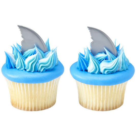 Vanilla cupcakes topped with blue frosting and shark fin toppers, perfect for ocean or Shark Week themes