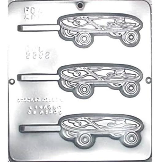 A chocolate lollipop mold shaped like a skateboard, with accentuated wheels and deck designs, perfect for skater-themed parties or events.
