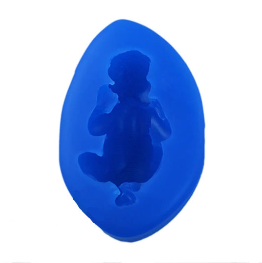 A blue silicone baking mold of a sleeping baby.