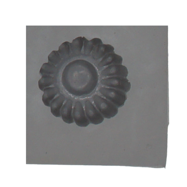 Close-up of a single cavity from the Small Daisy Rubber Mint Mold showing a round flower shape with textured petals, ideal for mint or candy making.