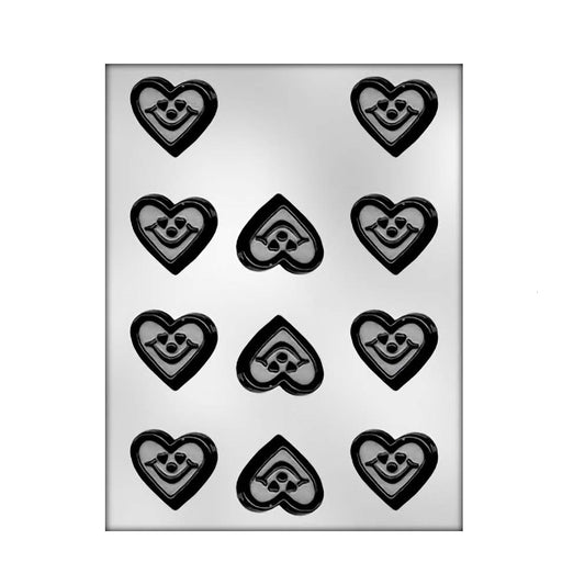 Chocolate mold with multiple heart-shaped cavities, each featuring a smiling face design, perfect for creating charming heart-shaped chocolates with a happy expression.