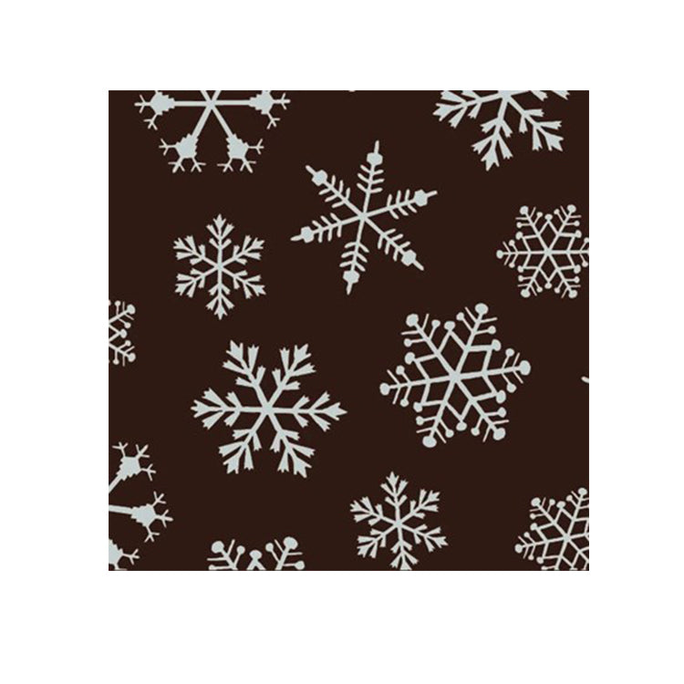 Snowflake chocolate transfer sheet with white snowflake pattern on dark chocolate background, sized 11" x 15".