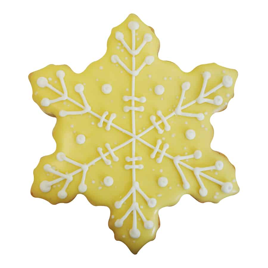 Yellow snowflake cookie with white piped royal icing snowflake pattern and decorative dots.