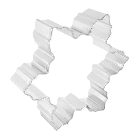 Angled view of the snowflake cookie cutter showing its wavy, detailed edges for creating festive shapes.