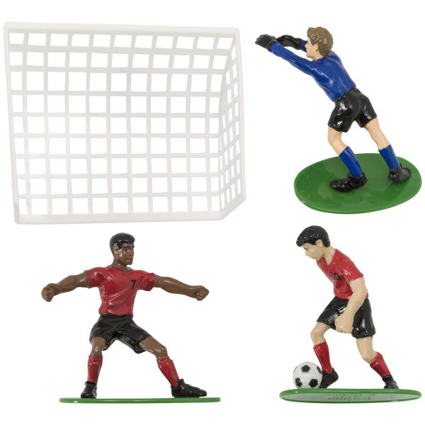 Set of three plastic soccer figurines with a goal net, including a goalkeeper and two players in red jerseys.