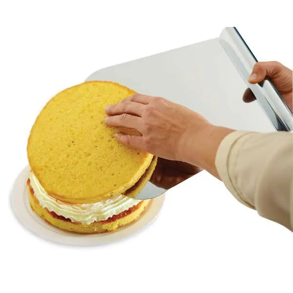 Mega lifter being used to transfer a cake layer with filling, illustrating its utility in cake assembly.