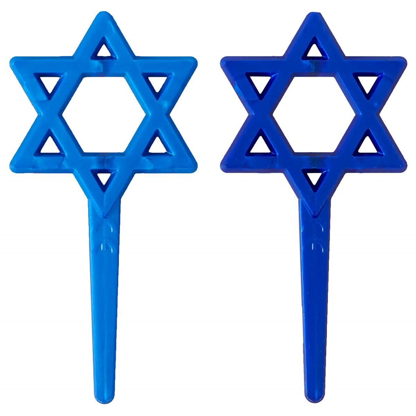 Two Star of David cupcake picks in light blue and dark blue plastic, each with a six-point star topper and a long pointed pick.