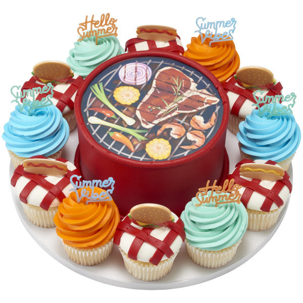 Summer barbecue cake and cupcakes decorated with Summer Sayings topper picks, grill-themed center cake, and colorful frosting.