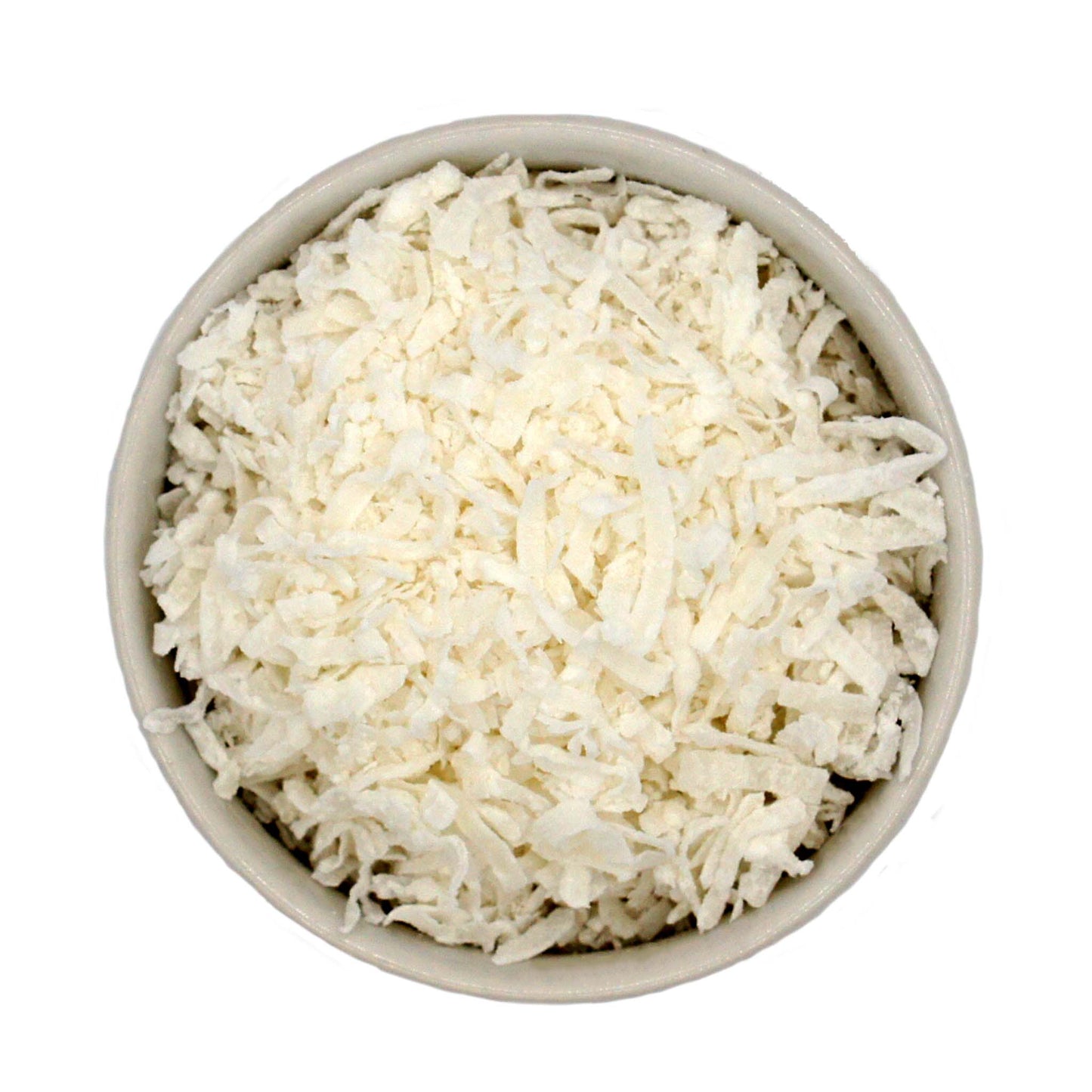 Overhead view of sweetened shredded coconut in a bowl, perfect for cakes, cookies, and candies