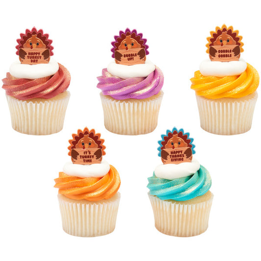 Colorful Thanksgiving cupcakes topped with turkey-themed picks, adding a playful and festive touch to holiday desserts.