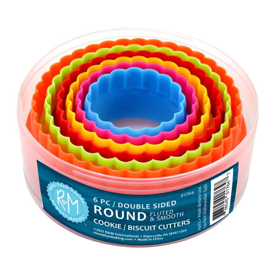 Set of 6 double-sided round cookie and biscuit cutters in bright colors, featuring fluted edges, neatly stored in a round container.