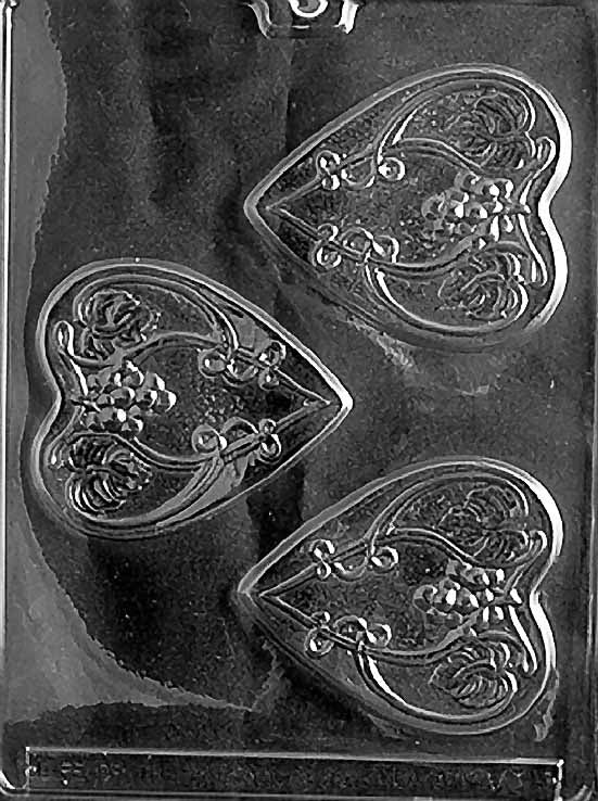 HEARTS WITH VINES chocolate mold with heart cavities decorated with vine patterns; clear mold.