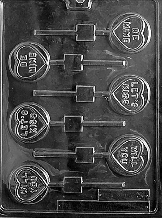 WILL YOU BE MINE / LET'S KISS chocolate mold with round cavities embossed with romantic sayings; clear mold.