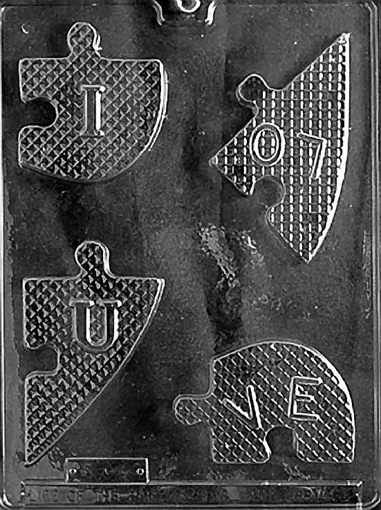 HEART PUZZLE chocolate mold with puzzle-shaped heart cavity; clear mold.