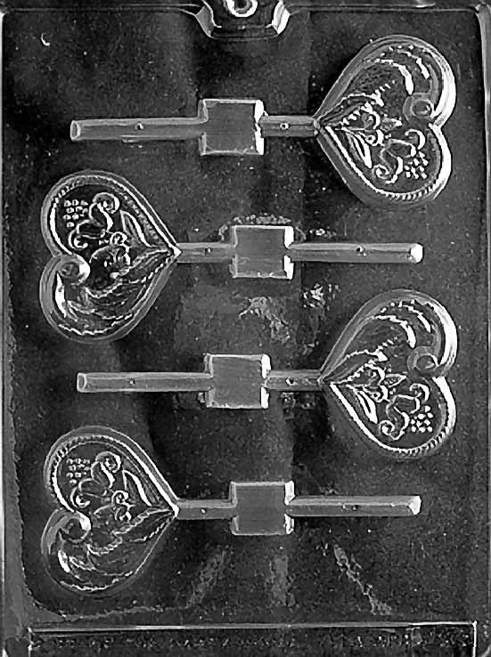 FANCY HEART Lollipop chocolate mold with ornate heart lollipop cavities; clear sheet.