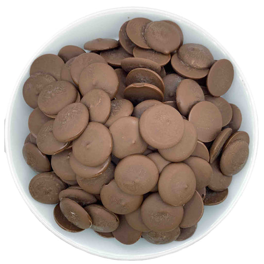 Top-down, detailed view showcasing the smooth texture and rich brown color of premium vegan and dairy free dark chocolate candy melts.