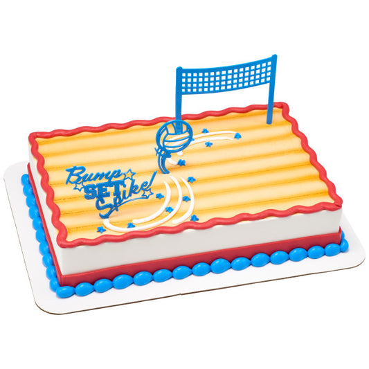 Sheet cake decorated with yellow frosting and blue volleyball toppers including a net and "Bump Set Spike!" pick.