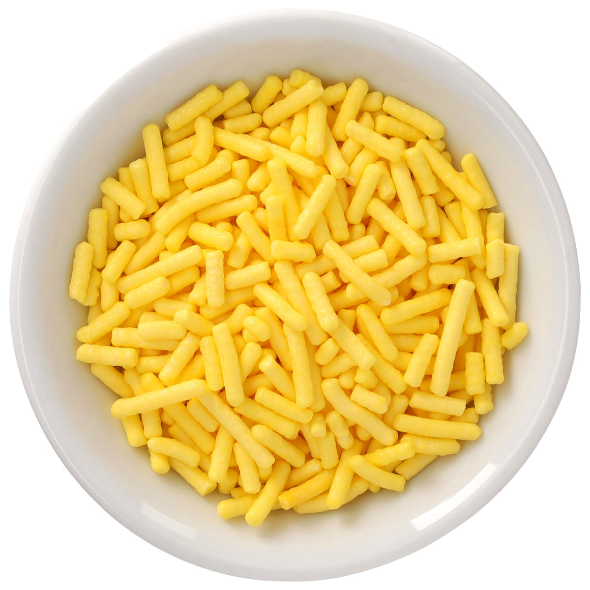 White bowl filled with bright yellow Natural Dyed Made Simply™ rod-shaped sprinkles, shown in a close-up overhead view.
