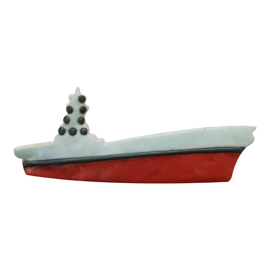 A decorated cookie shaped like an aircraft carrier, featuring a red and gray design with black accents for ship details.