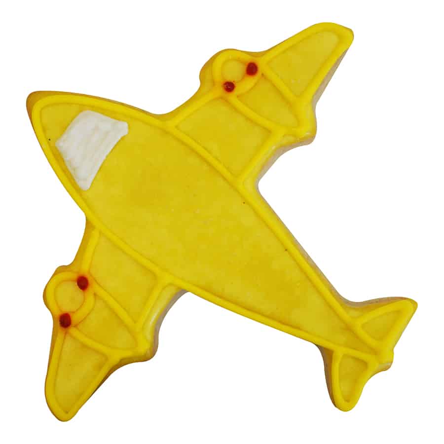 Decorated airplane-shaped cookie with yellow icing and fine piping details.