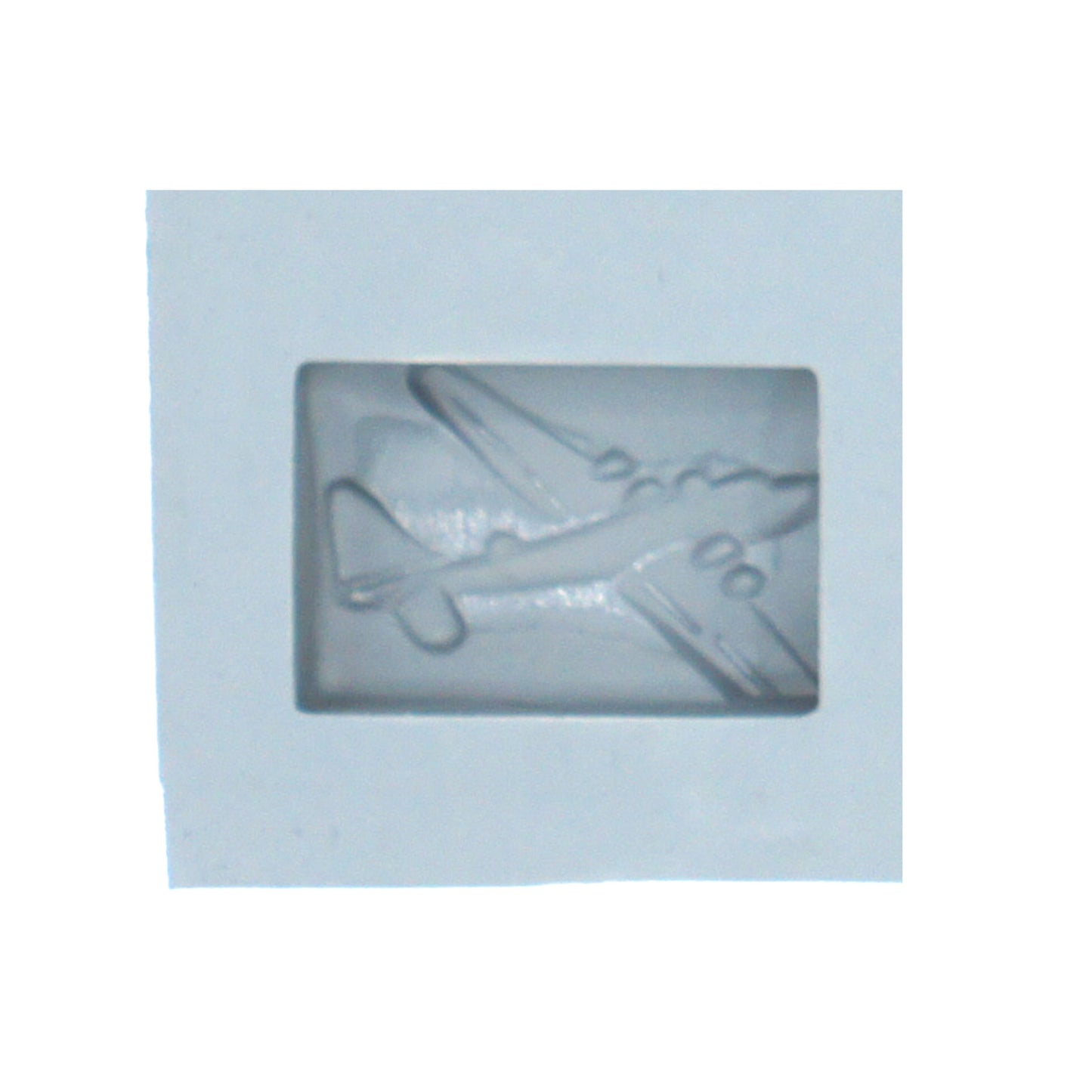 Close-up of airplane rubber mint mold cavity with detailed vintage aircraft design for aviation-themed candy making