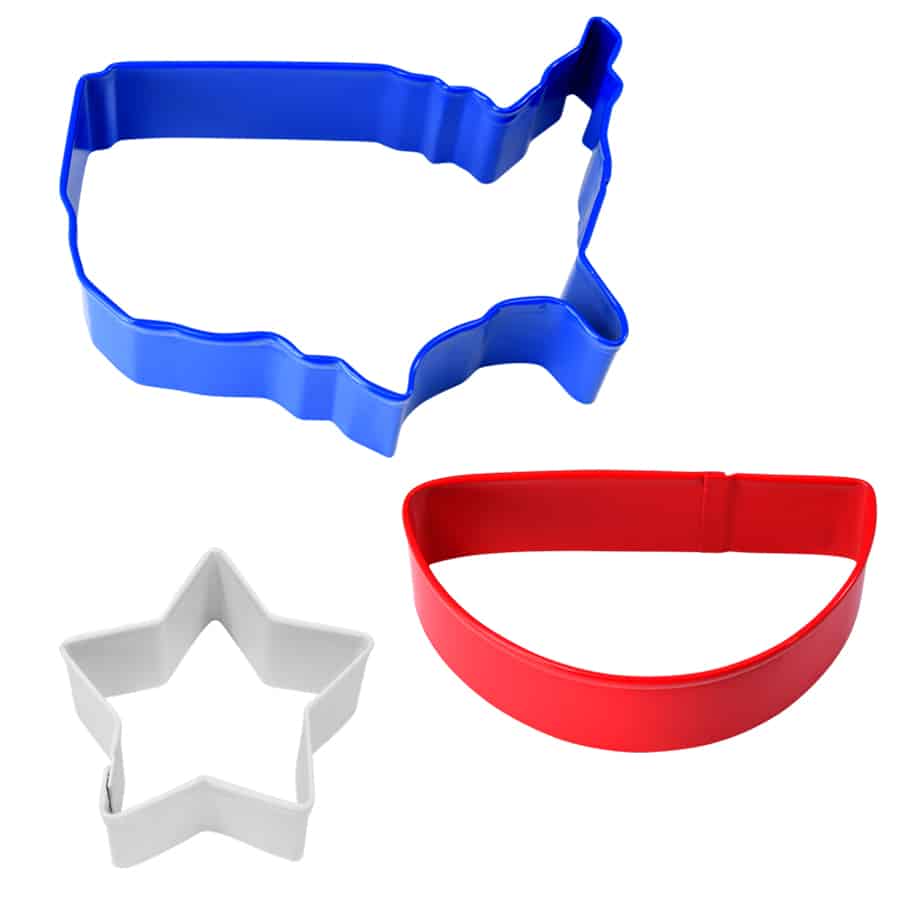 Three cookie cutters in blue, red, and white, shaped like the USA, a star, and a bunting banner.