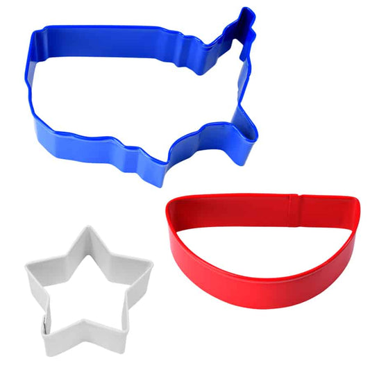 Three cookie cutters in blue, red, and white, shaped like the USA, a star, and a bunting banner.