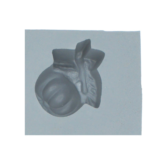 Close-up of apple and leaf rubber mint mold for fall or school-themed candies