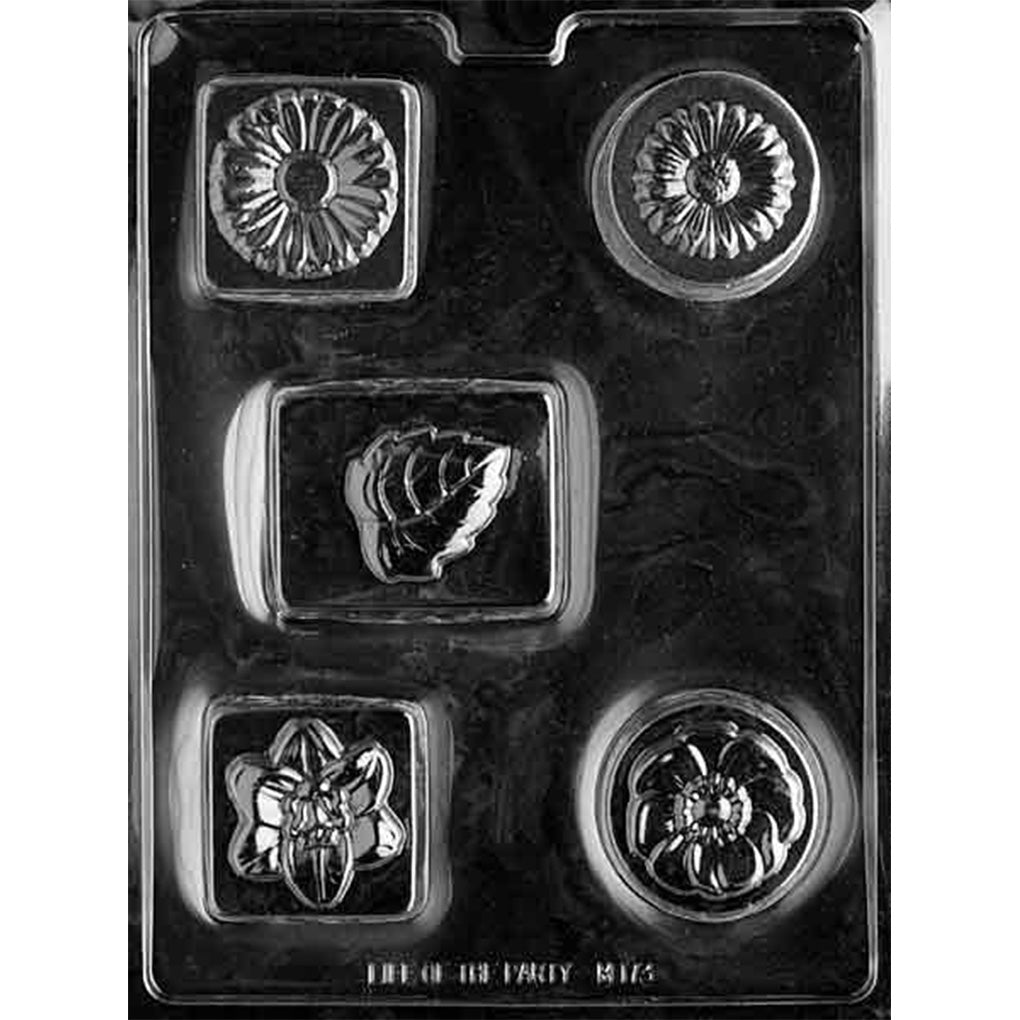 Clear chocolate mold with five assorted round, square, and rectangular bar cavities featuring raised daisies, layered flowers, and a sculpted leaf design.