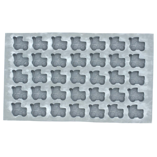 Full sheet of 35 baby buggy-shaped cavities in a natural rubber mold used for crafting mints, chocolates, or fondant decorations for baby celebrations.