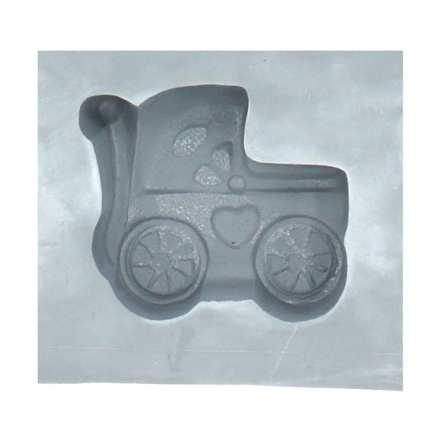 Close-up of a baby buggy-shaped cavity in a natural rubber mint mold, perfect for making themed cream cheese mints or chocolates for baby showers.