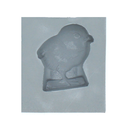 Close-up of a baby chick-shaped cavity in a natural rubber mint mold, perfect for spring-themed cream cheese mints, chocolates, or fondant decorations.