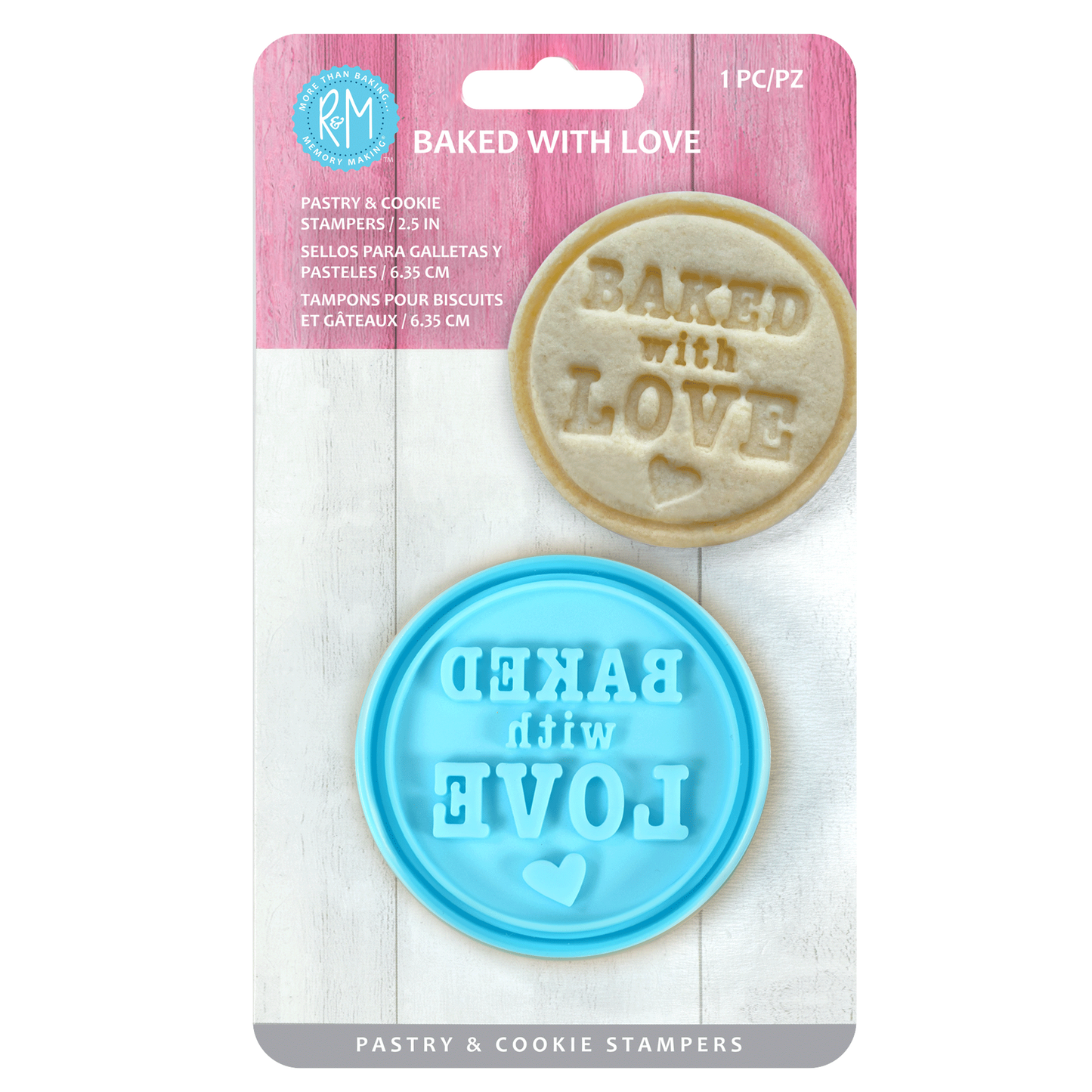 "Baked with Love" pastry and cookie stamper in retail packaging, featuring a blue plastic stamp and an embossed cookie.