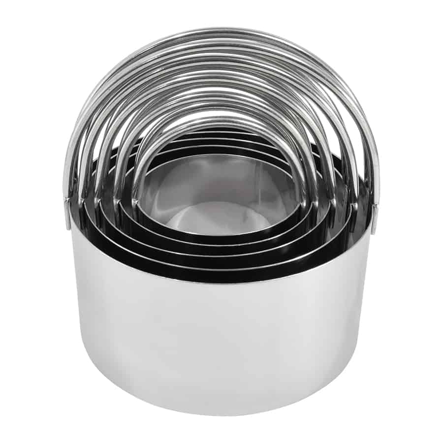 Set of five stainless steel biscuit cutters with arched handles, neatly stacked.