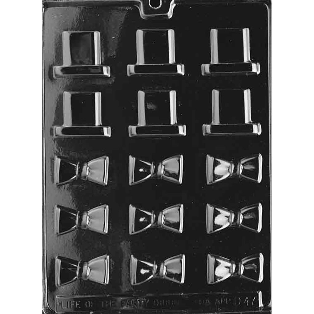 Clear plastic chocolate mold with small top hat and bow tie cavities arranged in rows, showing tall hat shapes with flat brims and bow ties with center knots on a dark background.