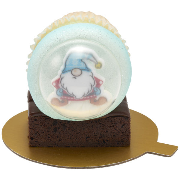 Brownie with cupcake globe topper on a gold treat board