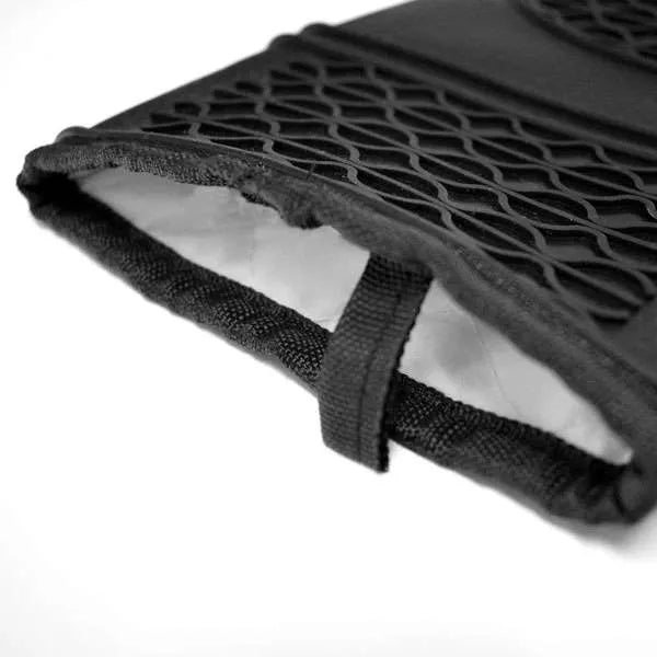 Close-up of the interior of a black silicone oven mitt, showing its quilted lining and hanging loop.