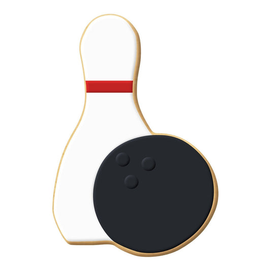 Bowling-themed sugar cookie decorated as a white bowling pin with a red stripe and a black bowling ball.