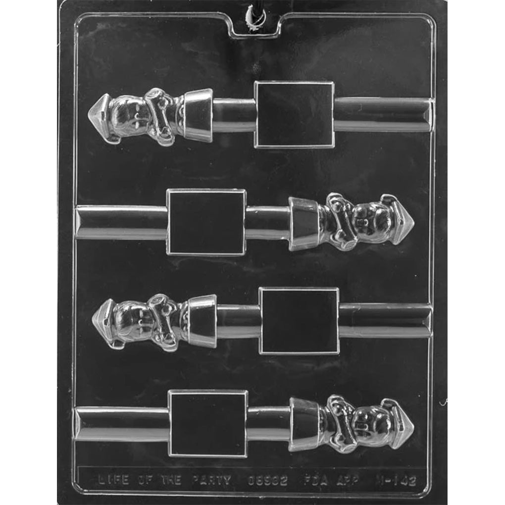 Clear plastic chocolate mold with four pretzel-topper cavities showing a small boy graduate figure beside a rectangular base area, arranged in rows on a dark background.