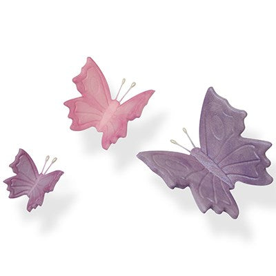 Three fondant butterflies in different sizes and shades of pink and purple created with the plunger cutter set.