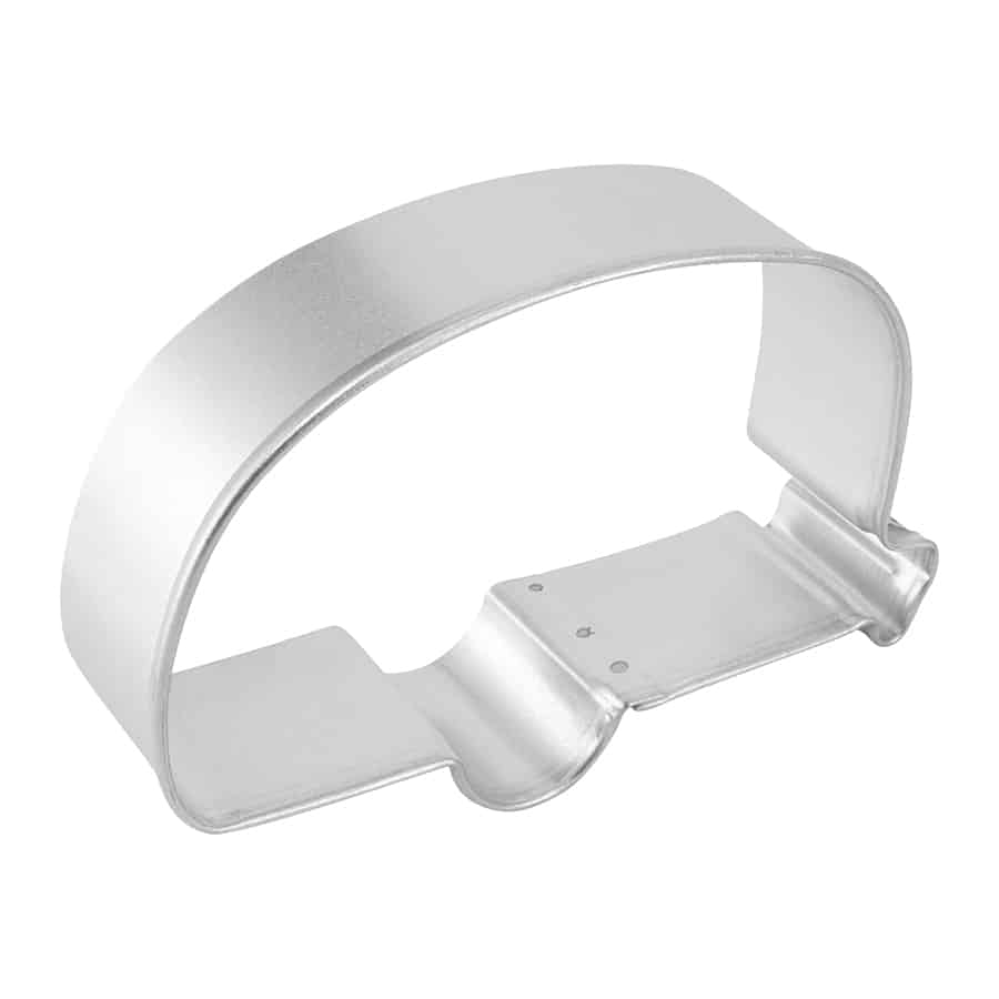 Angled side view of a camper cookie cutter, showing depth and structure.