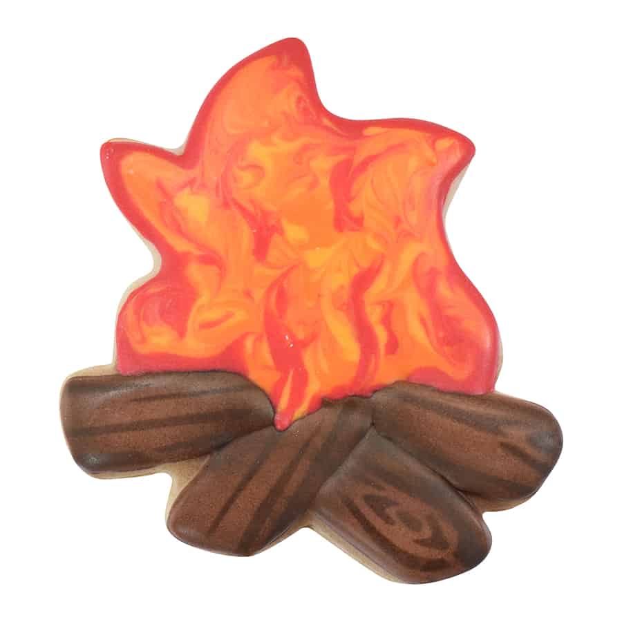 A decorated campfire cookie with vibrant orange and red icing flames and detailed brown logs.