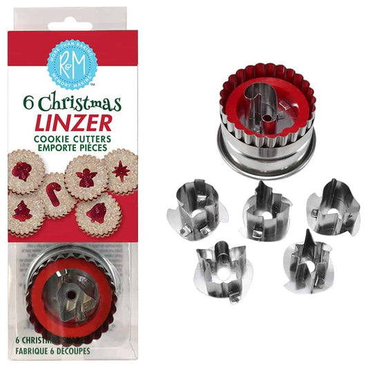 Christmas Linzer cookie cutter set with round fluted cutter and six interchangeable stainless steel inserts, displayed outside the box.