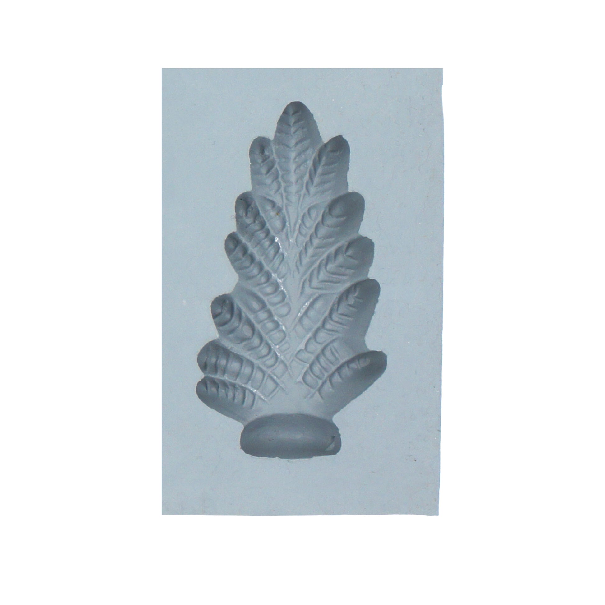 Close-up of Christmas tree rubber mint mold with detailed pine branch texture for holiday candy making