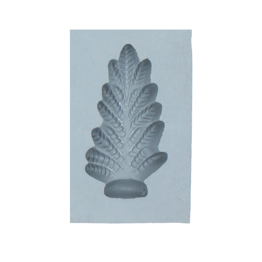 Close-up of Christmas tree rubber mint mold with detailed pine branch texture for holiday candy making