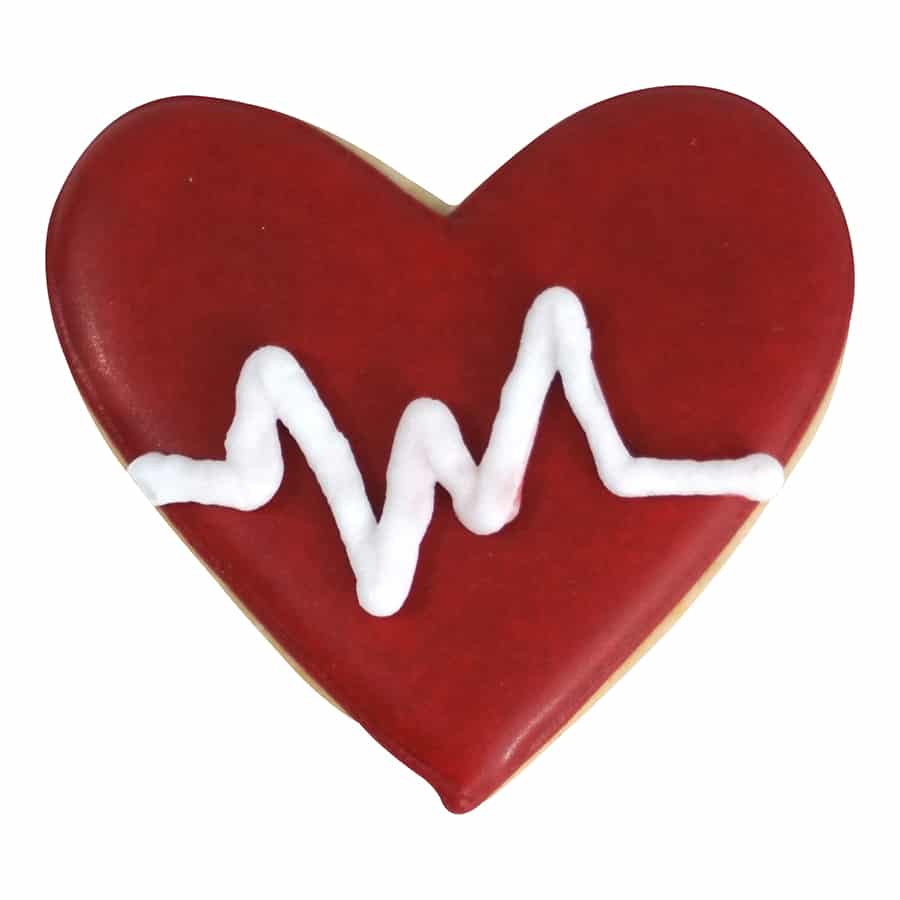 Decorated heart cookie with red icing and a white piped heartbeat design.