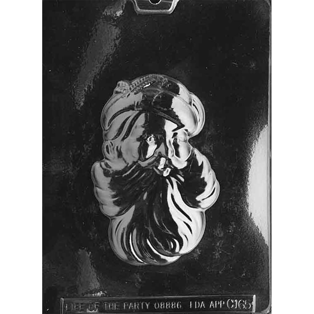Clear plastic chocolate mold with one large classic Santa head cavity featuring a jolly face, hat, and flowing beard detail, shown on a dark background for contrast.