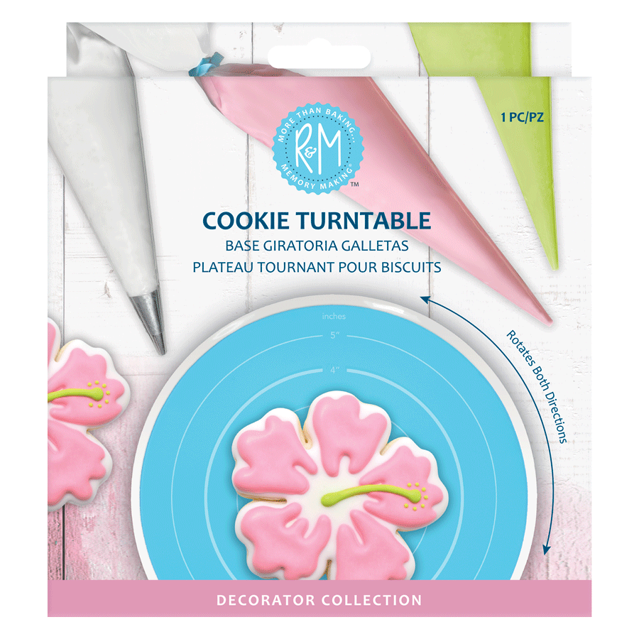 Cookie Turntable packaging with a decorated pink hibiscus cookie and piping bags.