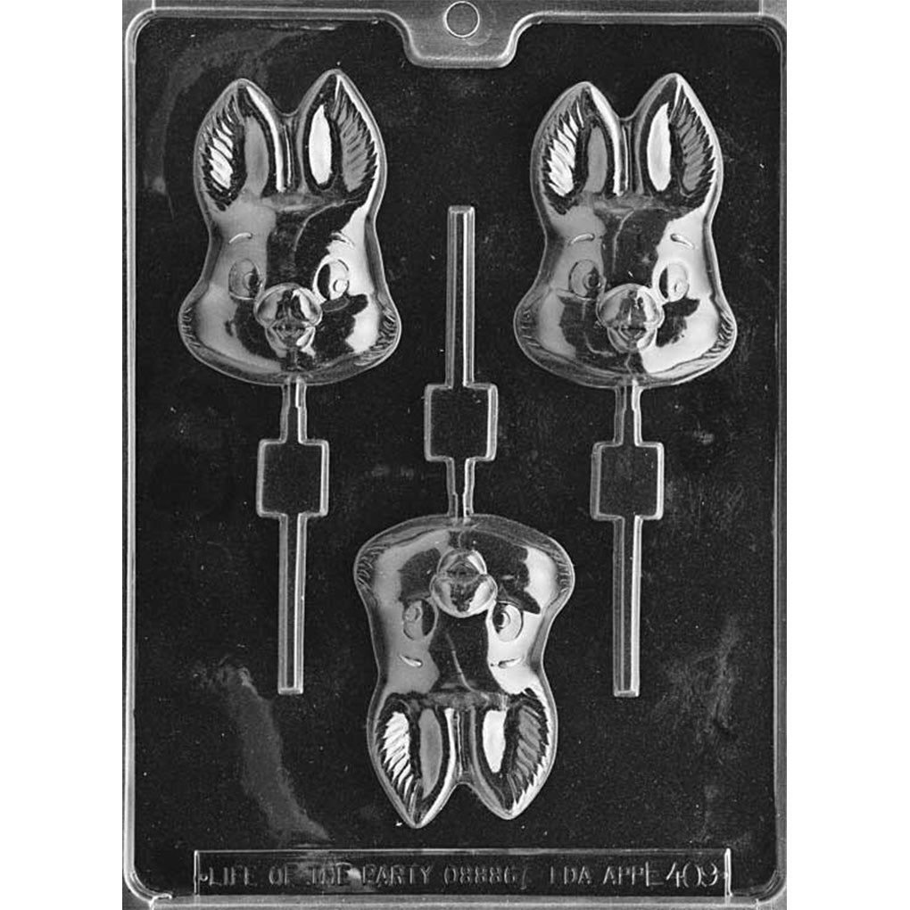 Clear plastic chocolate lollipop mold with three bunny face cavities featuring tall upright ears, detailed inner-ear lines, round eyes, and a raised nose, each connected to a stick channel on a dark background.