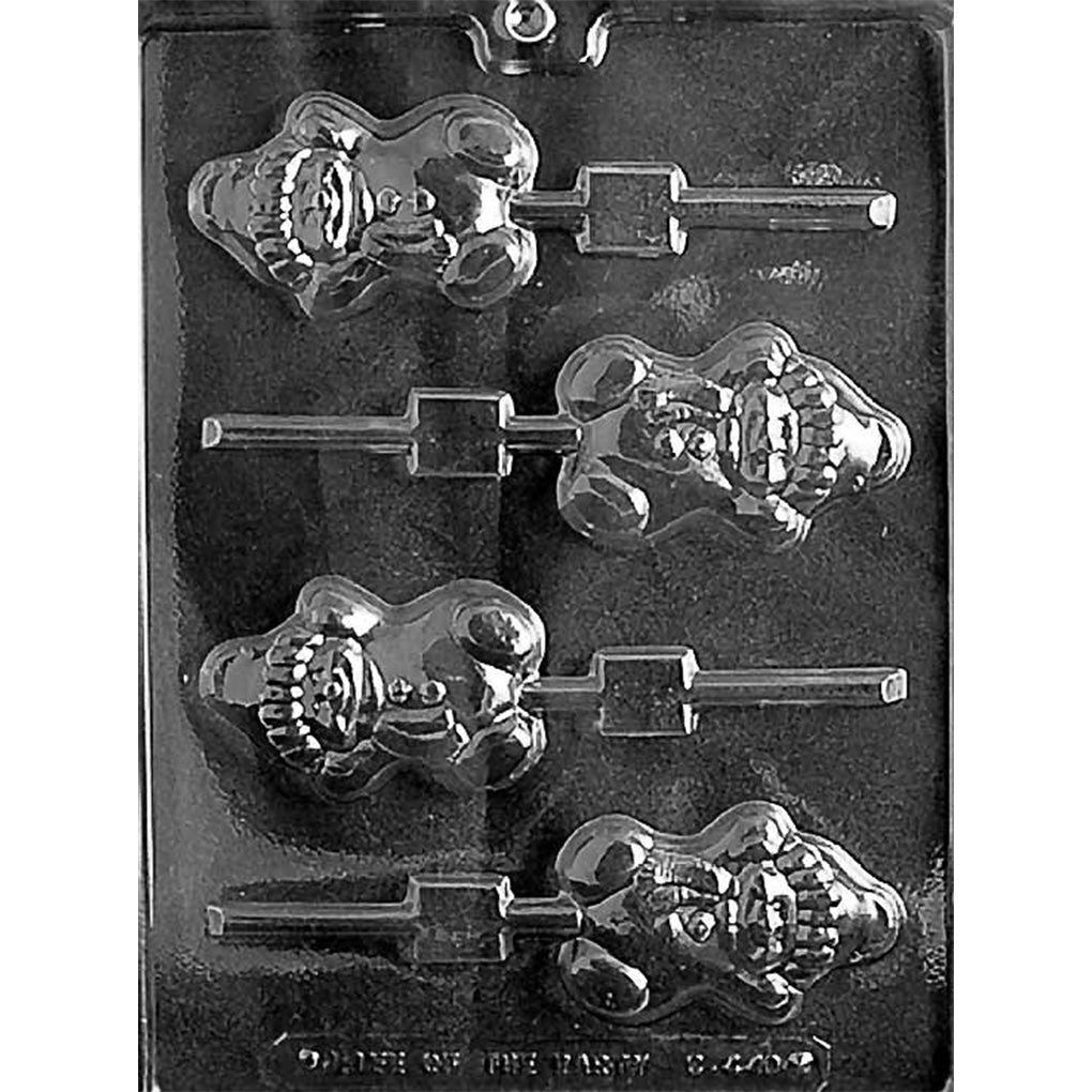 Clear plastic chocolate lollipop mold with four chubby snowman cavities, each showing a smiling face, raised arms, stocking cap, scarf, and stick channels on a dark background.